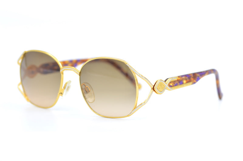 Enrique Loewe Knappe Gaia Sunglasses. Loewe Sunglasses. Women's Designer sunglasses. Luxury sunglasses. Gold platinum plated sunglasses.